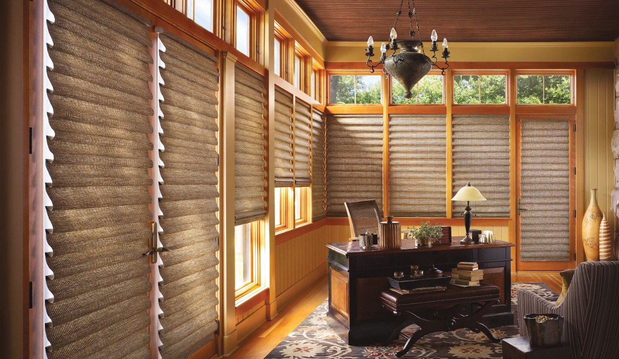 Warm wood colored roman shades in home office