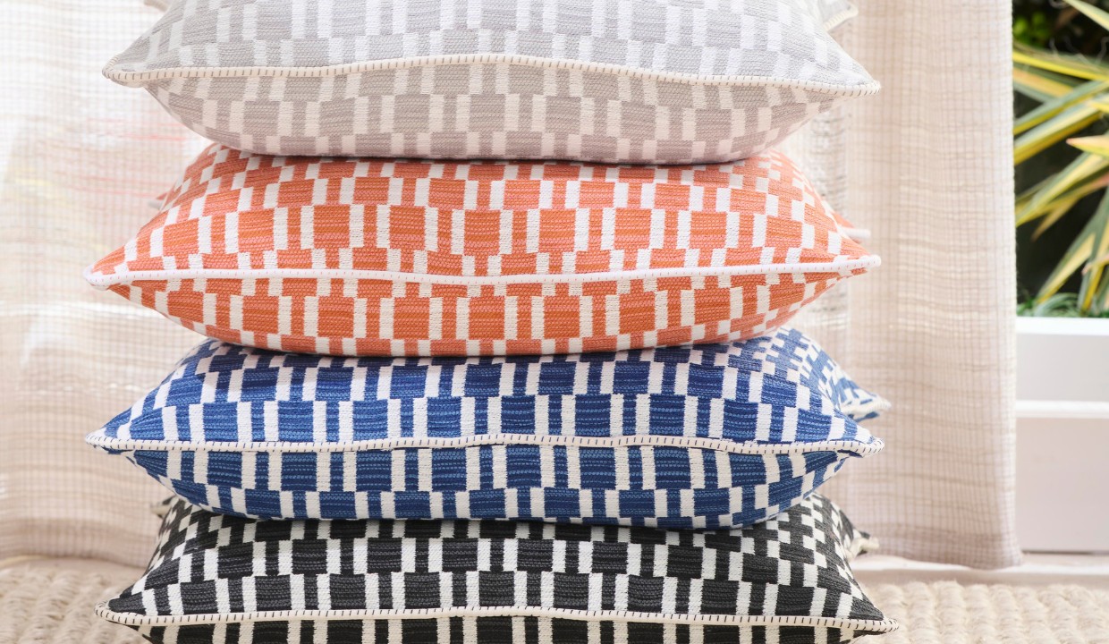 Stack of same pattern pillows but in different colors