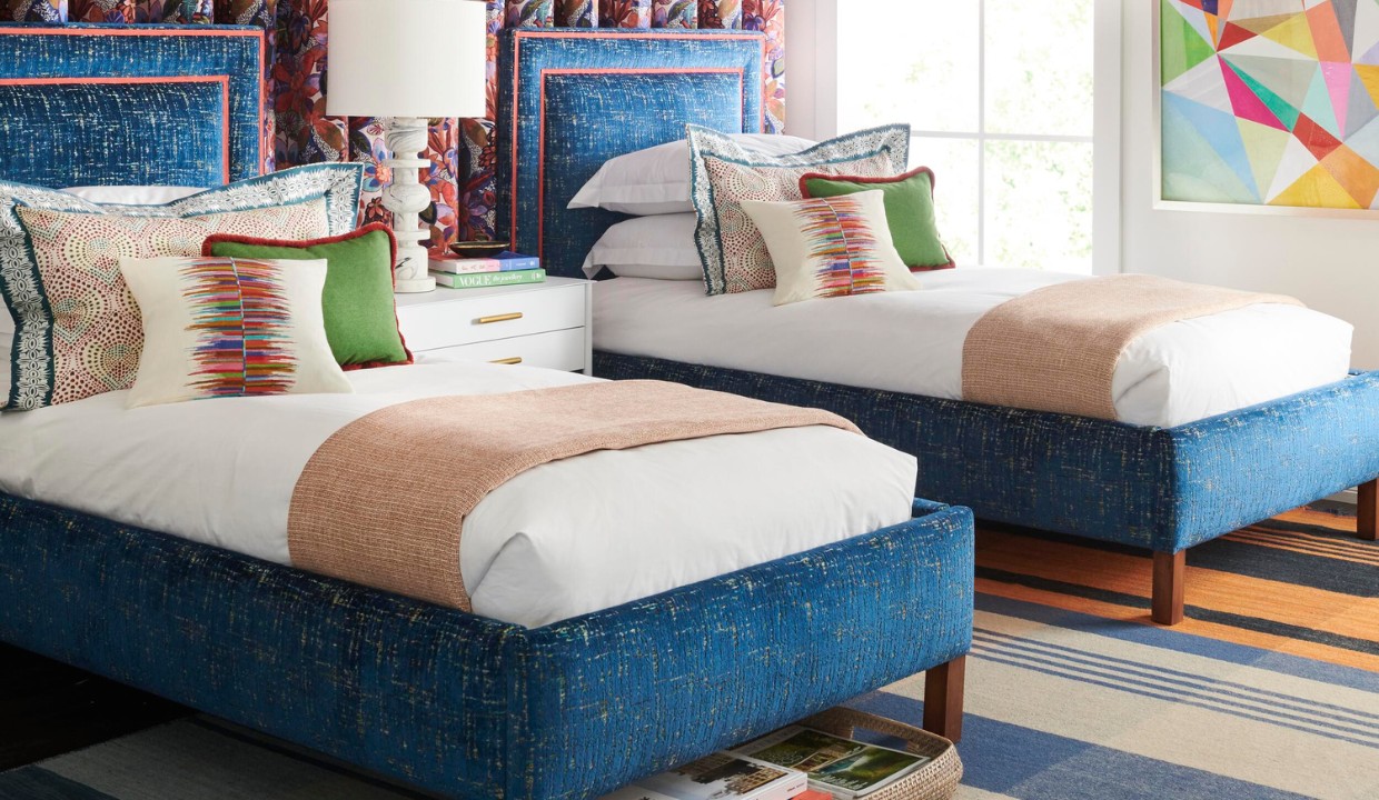 Twin beds with matching pillows and blankets